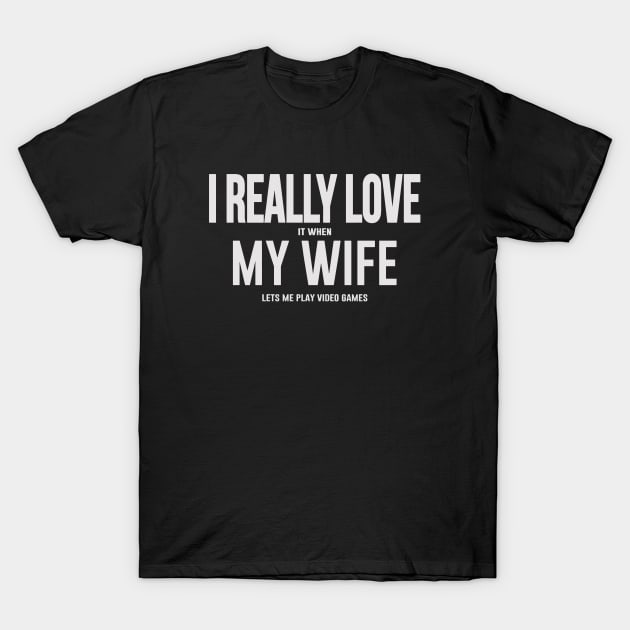 I Love It When My Girlfriend Lets Me T-Shirt 1 Black cotton t-shirt with humorous text design about video games, casual style, perfect for gaming enthusiasts.