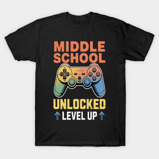 Black T-shirt with colorful game controller graphic and "Middle School Unlocked Level Up" text, casual style.