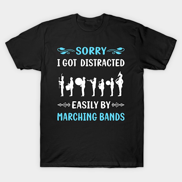 Black T-shirt with marching band graphic and "Sorry I Got Distracted Easily by Marching Bands" text, casual wear.