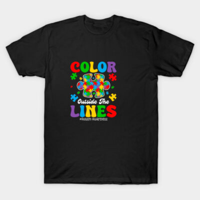 Black t-shirt with colorful puzzle piece design and "Color Outside The Lines" text, promoting autism awareness.