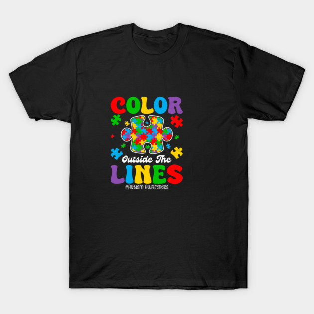 Black t-shirt with colorful puzzle piece design and "Color Outside The Lines" text, promoting autism awareness.
