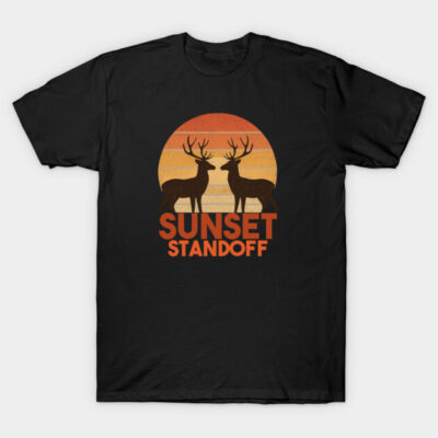 Black T-shirt featuring a sunset standoff design with two deer silhouettes, perfect for casual wear and outdoor enthusiasts.