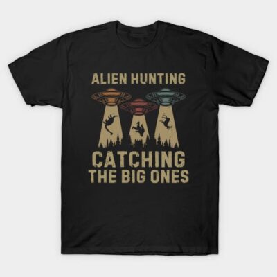 Black t-shirt with "Alien Hunting Catching the Big Ones" graphic, featuring UFOs and forest design. Casual wear.