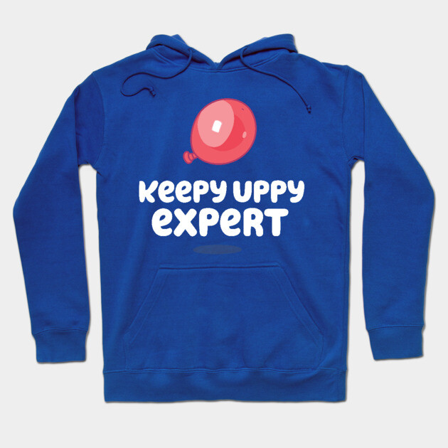 Blue hoodie with "Keepy Uppy Expert" text and red balloon graphic, casual style, suitable for everyday wear.