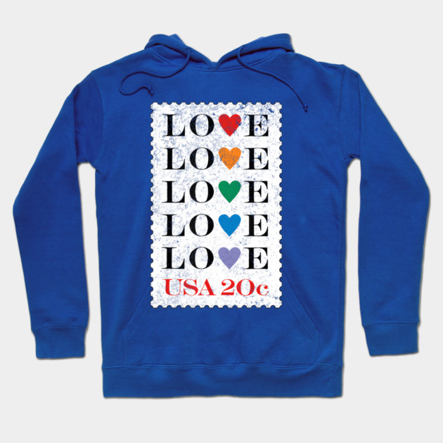 Blue hoodie with colorful "LOVE" stamp design, cozy cotton material, perfect for casual wear and gifting.