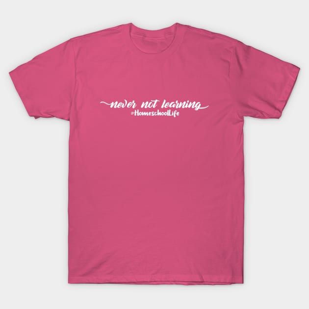 Pink unisex t-shirt with "never not learning #HomeschoolLife" text, casual style, cotton material.