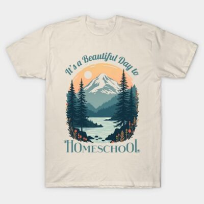 Beige T-shirt with "It's a Beautiful Day to Homeschool" text and scenic mountain design, casual outdoor wear.