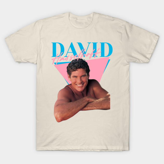 Retro beige t-shirt with vibrant pink and blue geometric design, perfect for casual wear and vintage style enthusiasts.
