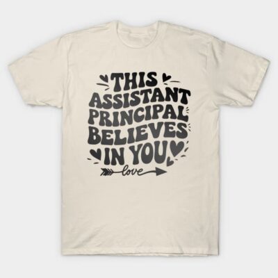 Cream T-shirt with motivational text "This Assistant Principal Believes in You," casual wear, cotton blend, unisex style.
