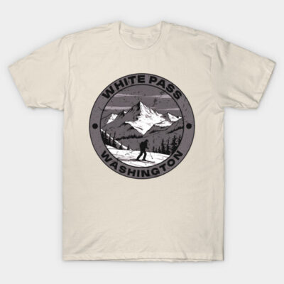 Beige t-shirt with "White Pass Washington" mountain graphic, casual style, ideal for outdoor enthusiasts.