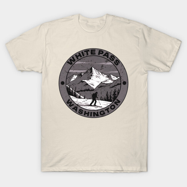 Beige t-shirt with "White Pass Washington" mountain graphic, casual style, ideal for outdoor enthusiasts.