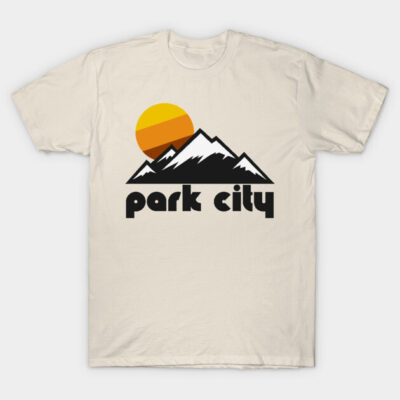 Cream t-shirt featuring a Park City mountain graphic with an orange sunset, casual style, ideal for outdoor enthusiasts.