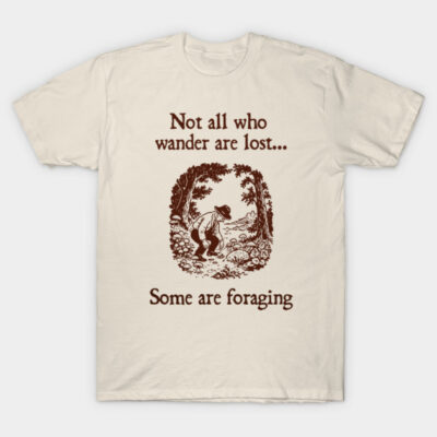 Cream t-shirt with brown "Not all who wander are lost... Some are foraging" design, featuring a nature scene graphic.
