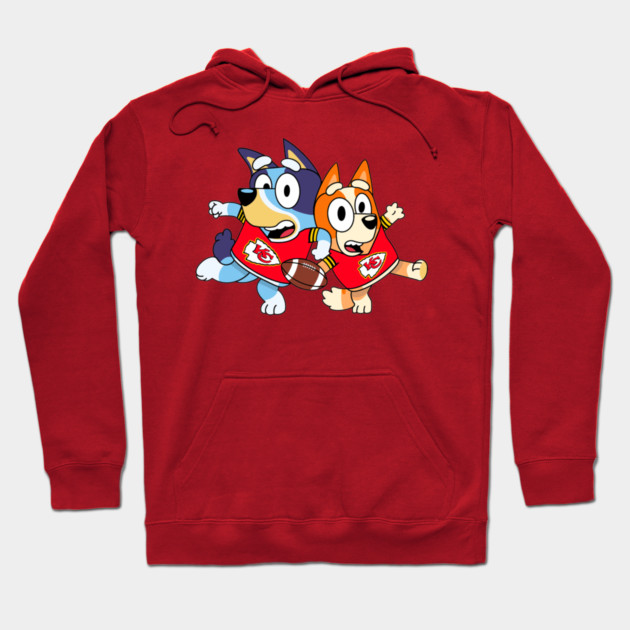 Red hoodie with playful cartoon print, featuring two dogs in football jerseys, perfect for casual wear and comfort.