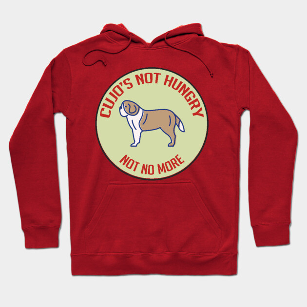 Red hoodie featuring playful dog design with "Cujo's Not Hungry" text, perfect for casual wear. Cotton material.