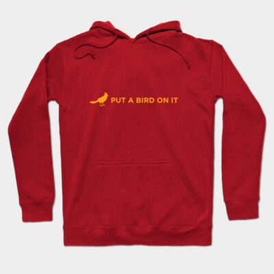 Red hoodie with yellow bird graphic and "Put a Bird on It" text, cotton material, casual style, unisex design.