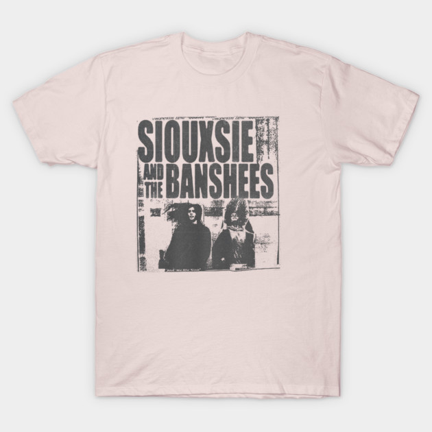 Vintage-style pink t-shirt with black band graphic print, casual cotton material for music fans.