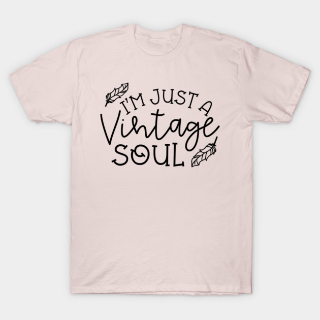 Beige t-shirt with "I'm Just a Vintage Soul" text and feather design, casual style, cotton material, unisex fit.