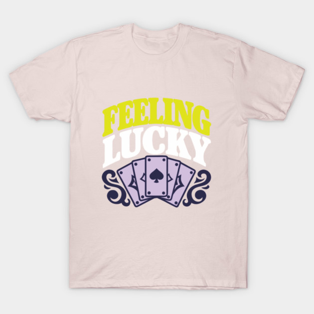 "Beige t-shirt with 'Feeling Lucky' text and playing cards design, casual style, soft cotton fabric."