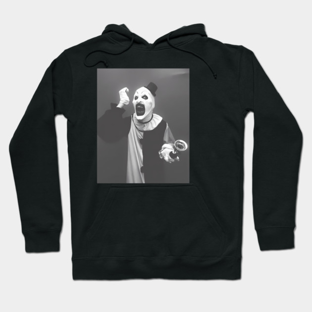 Black cotton hoodie with a black-and-white clown print, unisex design, ideal for casual wear or cool weather.