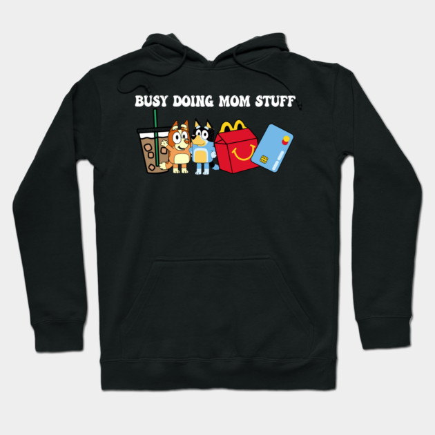 Black hoodie with "Busy Doing Mom Stuff" text and cute graphics, perfect for casual wear. Cotton material.