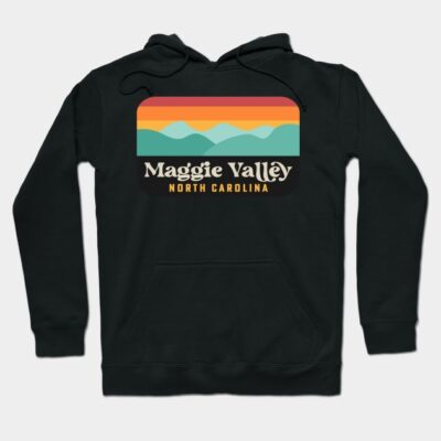 Black hoodie with retro Maggie Valley North Carolina design, featuring colorful mountain landscape graphic.