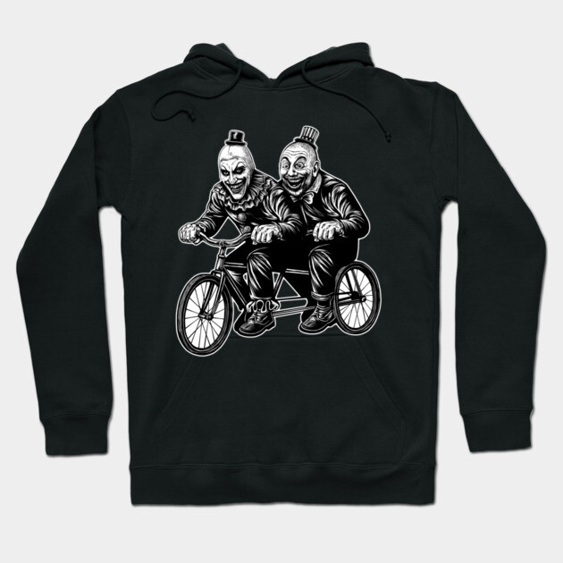 Black hoodie with monochrome clown bicycle design, made of cotton, perfect for casual wear and cooler weather.