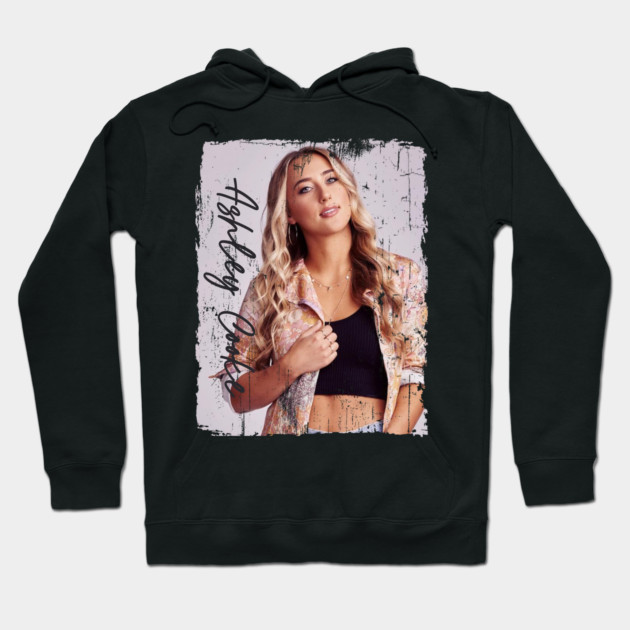 Black hoodie with artistic front print, casual style, cozy cotton material, ideal for everyday wear.
