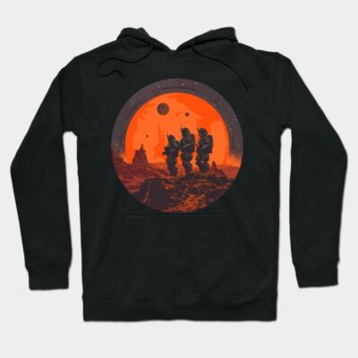Black hoodie with vibrant orange space-themed graphic, featuring astronauts on a lunar landscape. Cozy cotton blend.