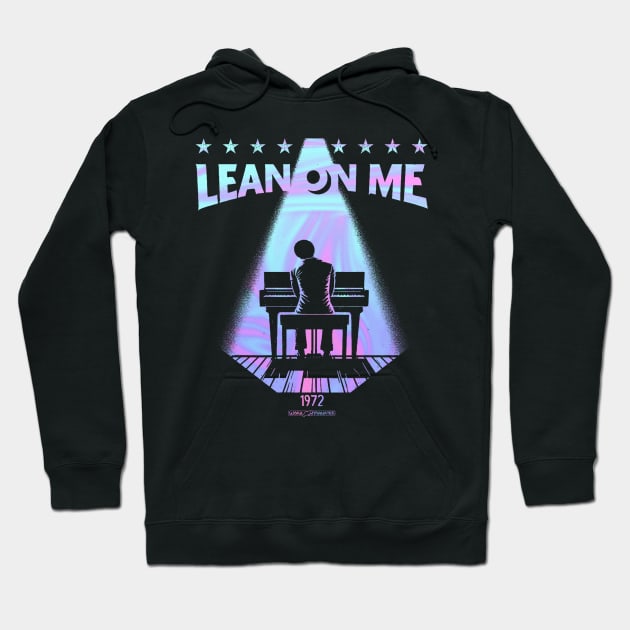 Black hoodie with "Lean On Me" text and piano graphic, retro style, made of cotton, casual wear.