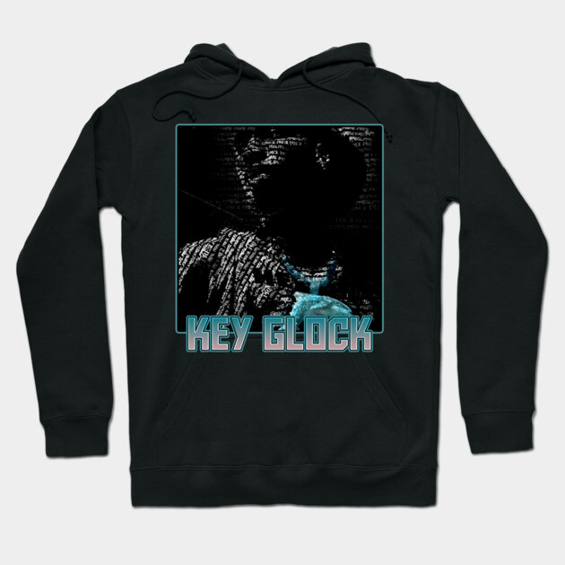 Black hoodie with graphic print and "KEY GLOCK" text, casual streetwear style, cotton material, unisex.