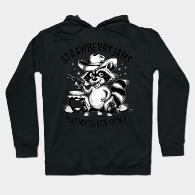 Black hoodie with raccoon graphic, cowboy hat, and text "Strawberry Jams But My Glock Don't"; casual style sweater.