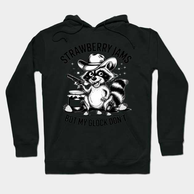 Black hoodie with raccoon graphic, cowboy hat, and text "Strawberry Jams But My Glock Don't"; casual style sweater.