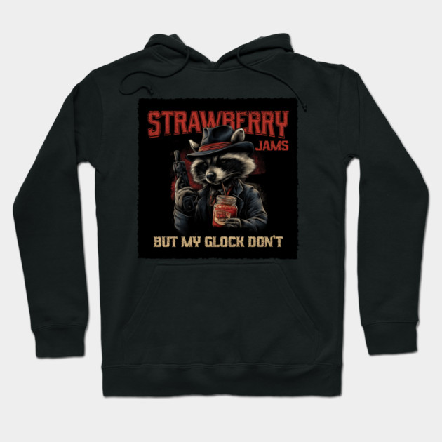 Black hoodie with raccoon graphic, "Strawberry Jams" text, humorous street style, cotton blend, casual wear.