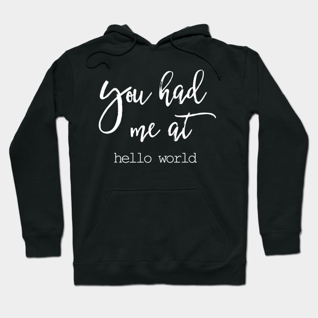 Black hoodie with white "You had me at hello world" text, casual style, cozy cotton blend, perfect for everyday wear.