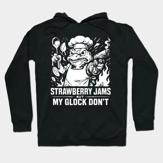 Black graphic hoodie with bold text and chef design, featuring "Strawberry Jams" phrase, casual wear, cotton material.