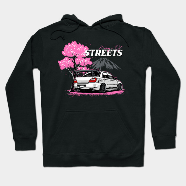 Black hoodie featuring street racing car with cherry blossom and mountain graphic, ideal for casual wear.
