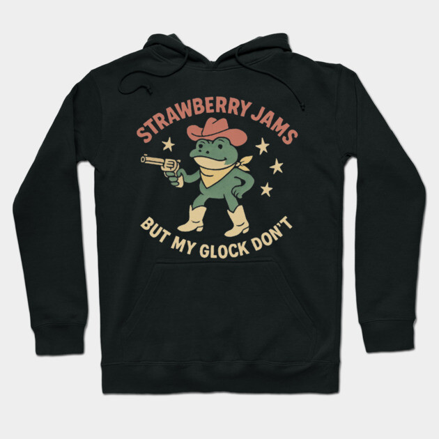 Black hoodie with playful frog and text graphic, featuring cowboy theme. Casual wear, soft material, unisex design.