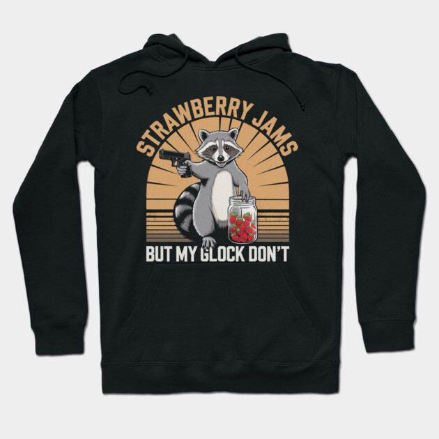 Black hoodie with raccoon graphic, "Strawberry Jams" text, casual wear, cotton blend, humorous design.