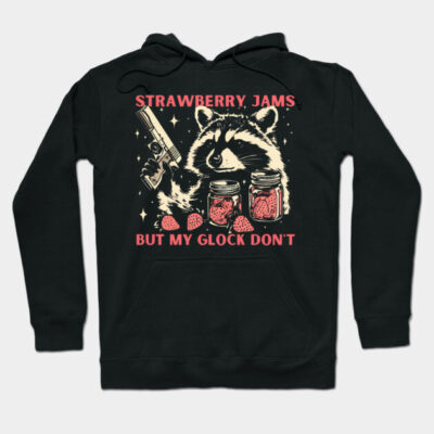 Black hoodie with raccoon design, holding jars and text "Strawberry Jams, But My Glock Don't," casual wear, cotton blend.