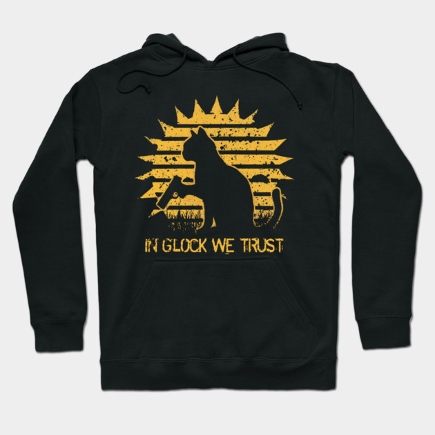 Black hoodie with yellow graphic of a cat and text, "In Glock We Trust," casual style, cotton blend material.