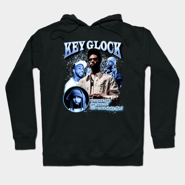 Black graphic hoodie with bold text and images, casual streetwear style, suitable for everyday wear, cotton blend material.