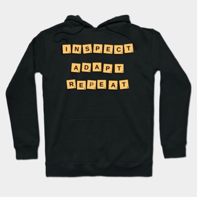 Black hoodie with yellow Scrabble-style tiles spelling "Inspect Adapt Repeat," ideal for casual wear.