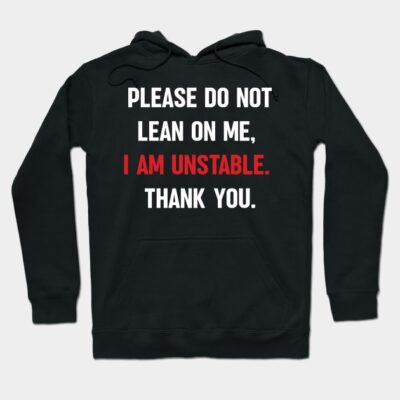 Black hoodie with humorous text "Please do not lean on me, I am unstable" in white and red. Casual and comfortable.