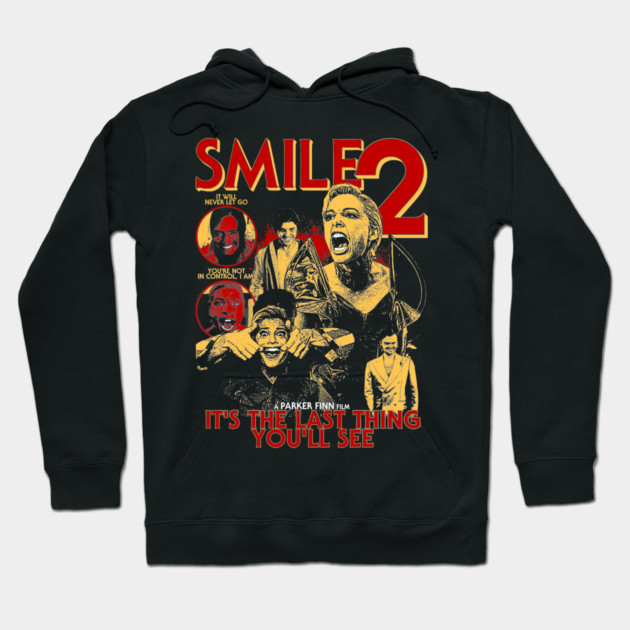Black "Smile 2" graphic hoodie featuring horror-themed design, perfect for casual wear, cotton material.