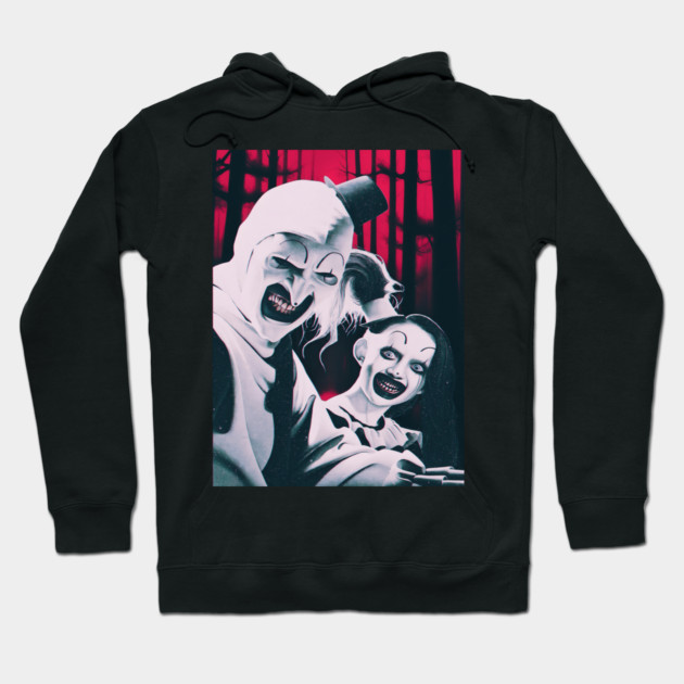 Black horror-themed hoodie with creepy clown design, perfect for Halloween or casual wear. Warm cotton material.