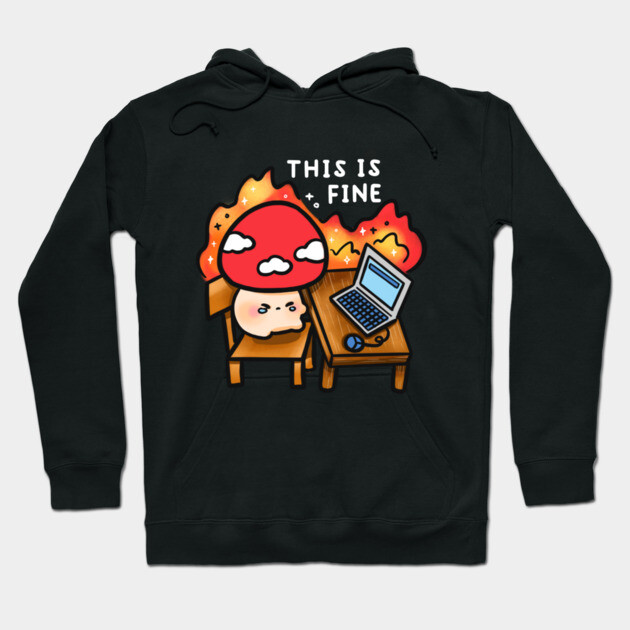 Black hoodie with playful "This is Fine" graphic, featuring a cartoon character and laptop, made from soft cotton blend.