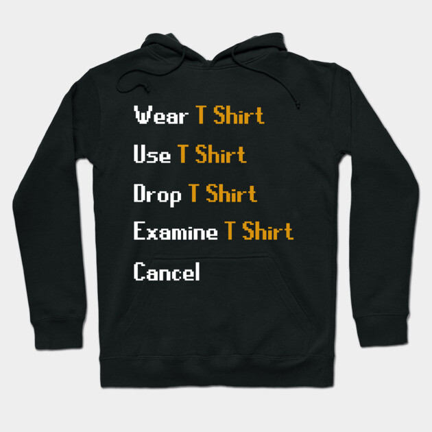 Black hoodie with gaming-inspired text design, featuring "Wear T Shirt" commands in pixel style. Casual wear.