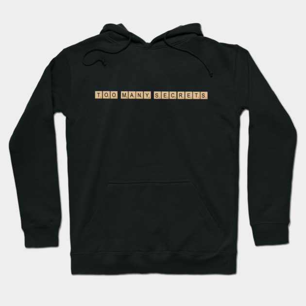 Black hoodie with "Too Many Secrets" text design, casual style, cotton material, perfect for everyday wear.