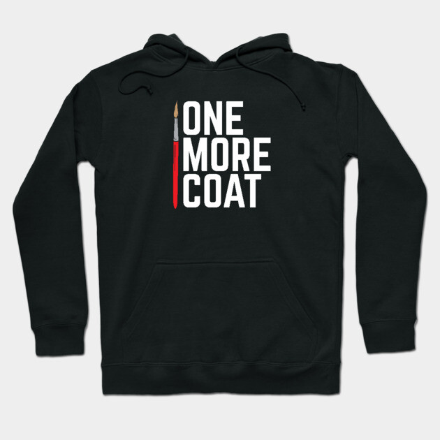 Black hoodie with "One More Coat" text and paintbrush graphic, perfect for artists, made from soft cotton blend.